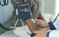 Woman getting her blood pressure checked
