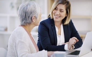 Senior woman meeting with a financial counselor