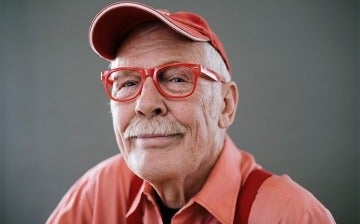 Man with glasses smiling